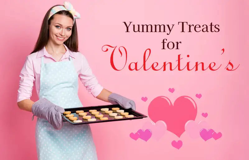 Image of happy baker with baking sheet of Valentine's cookies.