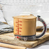 Dreamfarm Upcup adjustable measuring cup with batter.