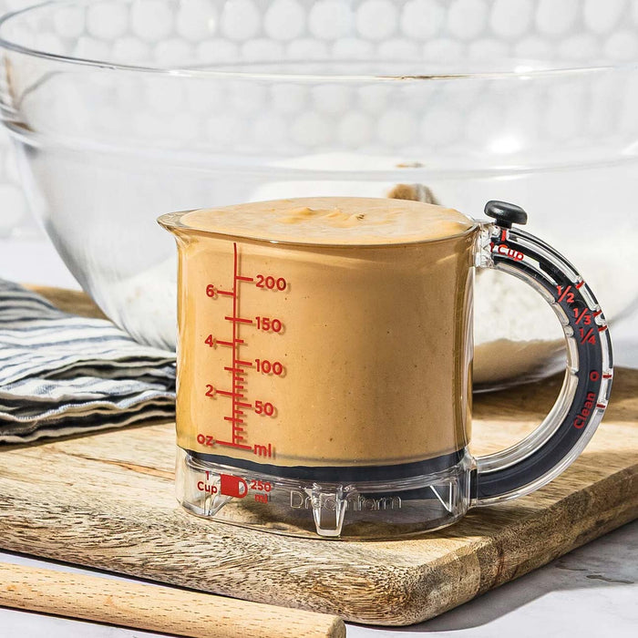 Dreamfarm Upcup adjustable measuring cup with batter.